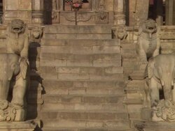 MS ZO View of Stone steps flanking  by carved statues of animals leading to temple doors  / Kathmandu, Central, Nepal Stock Footage