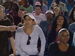 MS Man walking in front of crowd in bleachers / Homestead, FL, USA Stock Footage