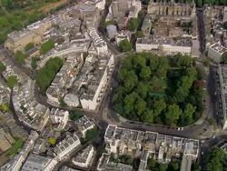 Aerial wide shot pan Belgrave Square and Wilton Crescent / London, England Stock Footage