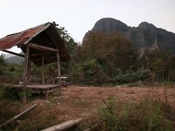 WS Tuk tuk moving on road near mountain /  Vang Vieng, Vientiane, Laos Stock Footage