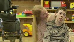 Child with Disability Laughing with Caregiver Stock Footage