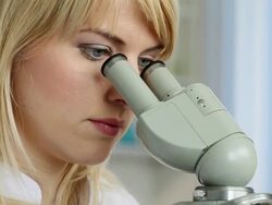 Scientist using a microscope Stock Footage