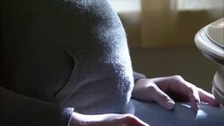 A pregnant woman moves a spoon closer to a syringe on a table. Stock Footage