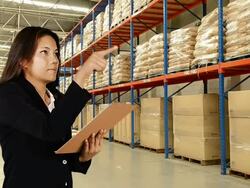 Business Woman Checking Inventory In Warehouse Stock Footage