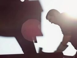 Man hammering outside Stock Footage