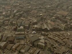 WS AERIAL ZI View of modern city and cabins in wood / Lagos, Nigeria Stock Footage