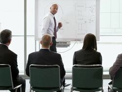  WS Businessman presenting to a group with dry-erase board / Seattle, Washington, United States Stock Footage