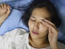 asian woman crying on bed Stock Footage