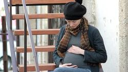 Pregnant woman in the city Stock Footage