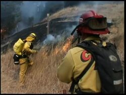 Emergency declared as wildfires spread, hundreds flee; burn-off News Clip