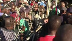 CLEAN : Food handouts for S Africa striking miners as pay deal looms News Clip