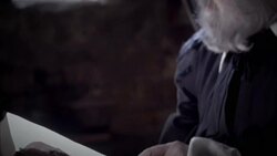 Nostradamus reads a book at his desk. Stock Footage