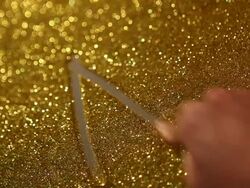 hand writing "A+" on golden sand background Stock Footage