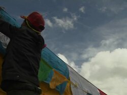Pan Right Shot People Tying Buddhist Prayer Flags Stock Footage