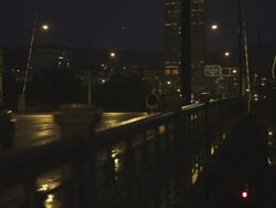 MS Shot of Cars and people cross Burnside bridge into Portland with sign in back side / Portland, Oregon, United States  Stock Footage