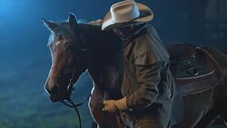 SLO MO Cowboy dismounting his horse at night Stock Footage