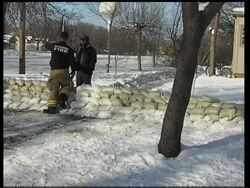 Chilly temperatures slow rise of swollen Red River News Clip