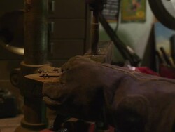 MS PAN Shot of man using drill press in home garage / Santa Cruz, California, United States Stock Footage