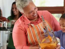 MS TD Three Generations of Women Cooking Holiday Meal in Kitchen / Richmond, Virginia, USA Stock Footage