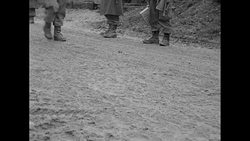 US soldiers near a Belgian town during World War II News Clip