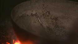 Glowing coals heat a copper kettle. Stock Footage