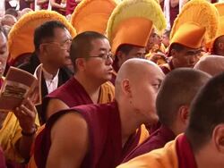 MS Some monks wearing large yellow head adornment AUDIO / Dharamsala, Himachal Pradesh, India Stock Footage