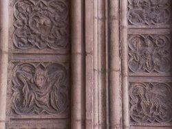 Carved frescoes fill the space between columns at the entrance to the Lyon Cathedral. Stock Footage