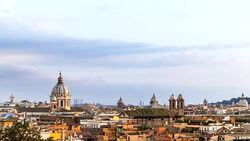 Long shot panoramic view of Rome with ancient roofs at sunset, Italy. April, 2016. Stock Footage