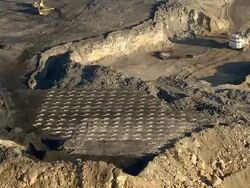 Wide Shot aerial pan,left push,out tracking,right , Machines and equipment idle in a coal strip,mine. / West Virginia Stock Footage