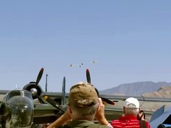 WS PAN ZO  crowd gathering  in front of Palm Springs air museum hangars  / Palm Springs, California , United states Stock Footage