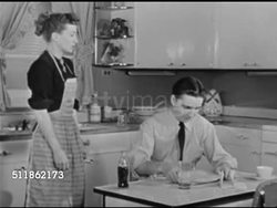 1948: CLAUDIA RADIO SHOW: DRAMATIZATION: Kathyrn Bard & Paul Crabtree ON SET kitchen, SOT 'David' (Paul Crabtree) & 'Claudia' (Kathyrn Bard) talking about income tax, she saying they can't afford it, he starts to count to ten. Instructional Video
