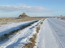 CLEAN: Winter landscape as snow covers Mont Saint-Michel in France News Clip