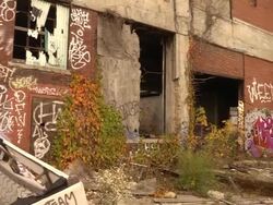 Pan of abandoned auto assembly plant Stock Footage