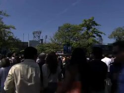 Crowds of people move towards Arthur Ashe Stadium at the US Open Stock Footage
