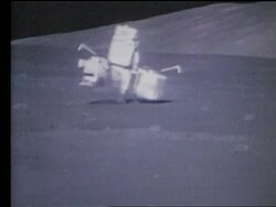 Astronaut carrying 2 big boxes walking on Moon Stock Footage