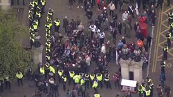 Aerial shots of police ensuring rival far-right and anti-fascist groups are kept apart during protests in central London News Clip