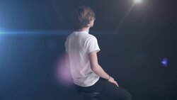 Young man rotates on swivel chair Stock Footage