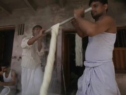 MS TD Men washing fabric in hot water / Varanasi, India Stock Footage