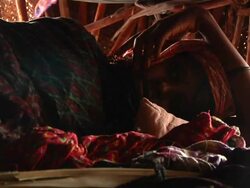 Woman who gave birth the day before fanning herself and baby Stock Footage