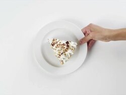 CU Woman hand entering setting down round white plate with slice of whipped cream pie, with nuts dessert / Omaha, Nebraska, United States Stock Footage