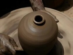 Man making a earthen pot on a pottery wheel  Stock Footage