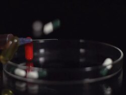 HD SUPER SLOW-MO: Medicaments In A Petri Dish Stock Footage