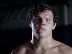 MS TU TD Wastler puts headgear on head / Riverside, California, United States Stock Footage