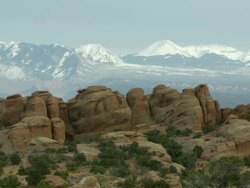 Sandstone layers with the La Sal Mountains Stock Footage