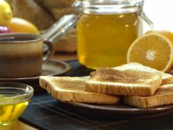 Honey dripping on a toast Stock Footage