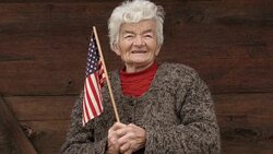 Senior Woman Holding USA Flag Looking at Camera and Smiling Stock Footage