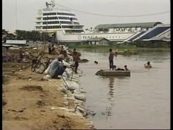 CAMBODIA: FLOODS THREATEN BUILDINGS News Clip