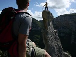 Climber throws rope to teammate below Stock Footage