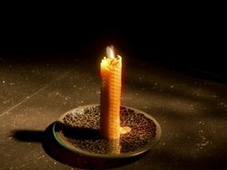 Time-Lapse Single candle burning down with shadows Stock Footage