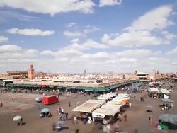 WS POV T/L View of  Djemaa el-Fna square crowded with people / Marrakech, Morocco Stock Footage